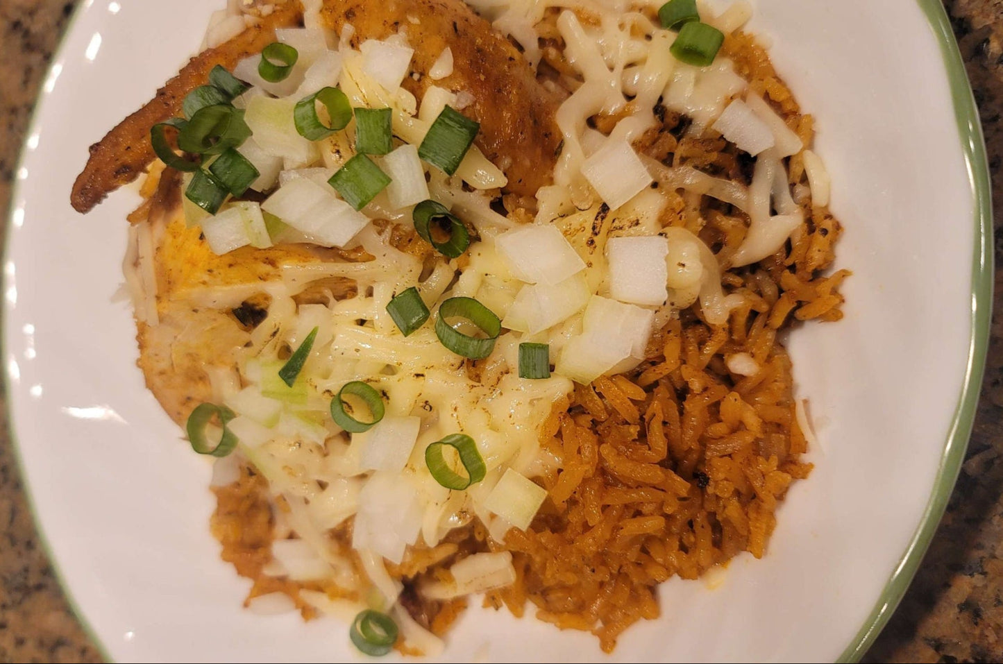 Spanish Rice plated topped with cheese