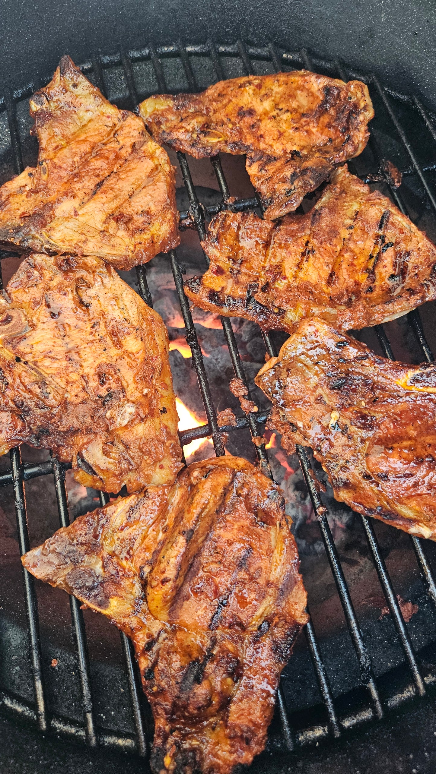 BBQ pork chops with santa maria seasoning on a grill