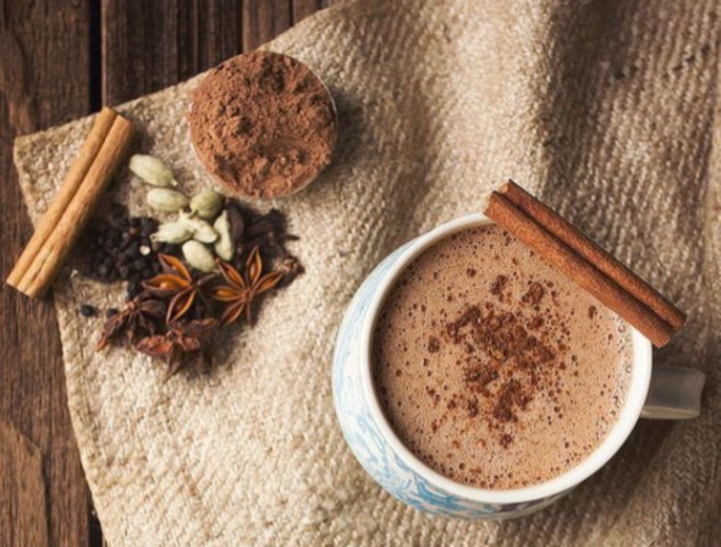 Chai Hot Cocoa in a mug image with whole spices 